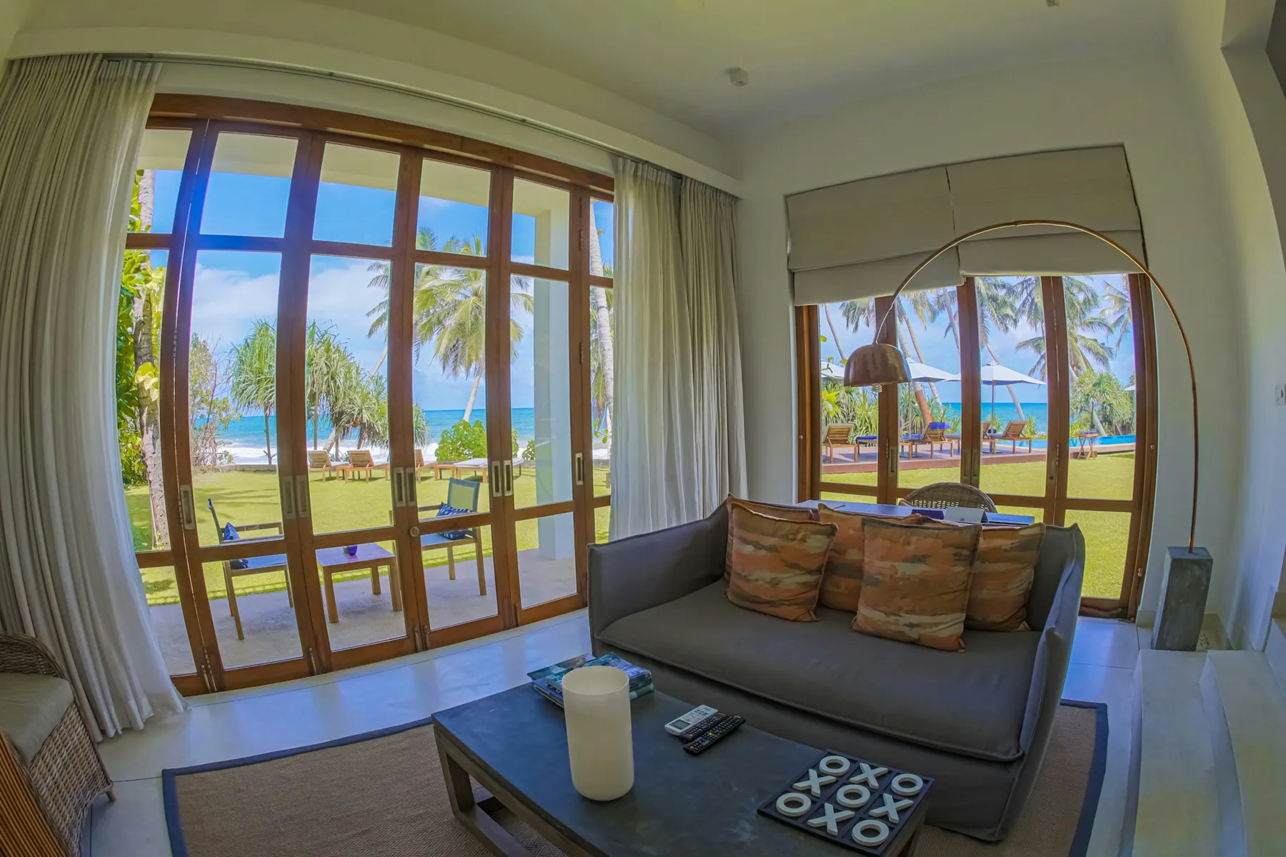 A contemporary Sri Lankan living room overlooking the coast