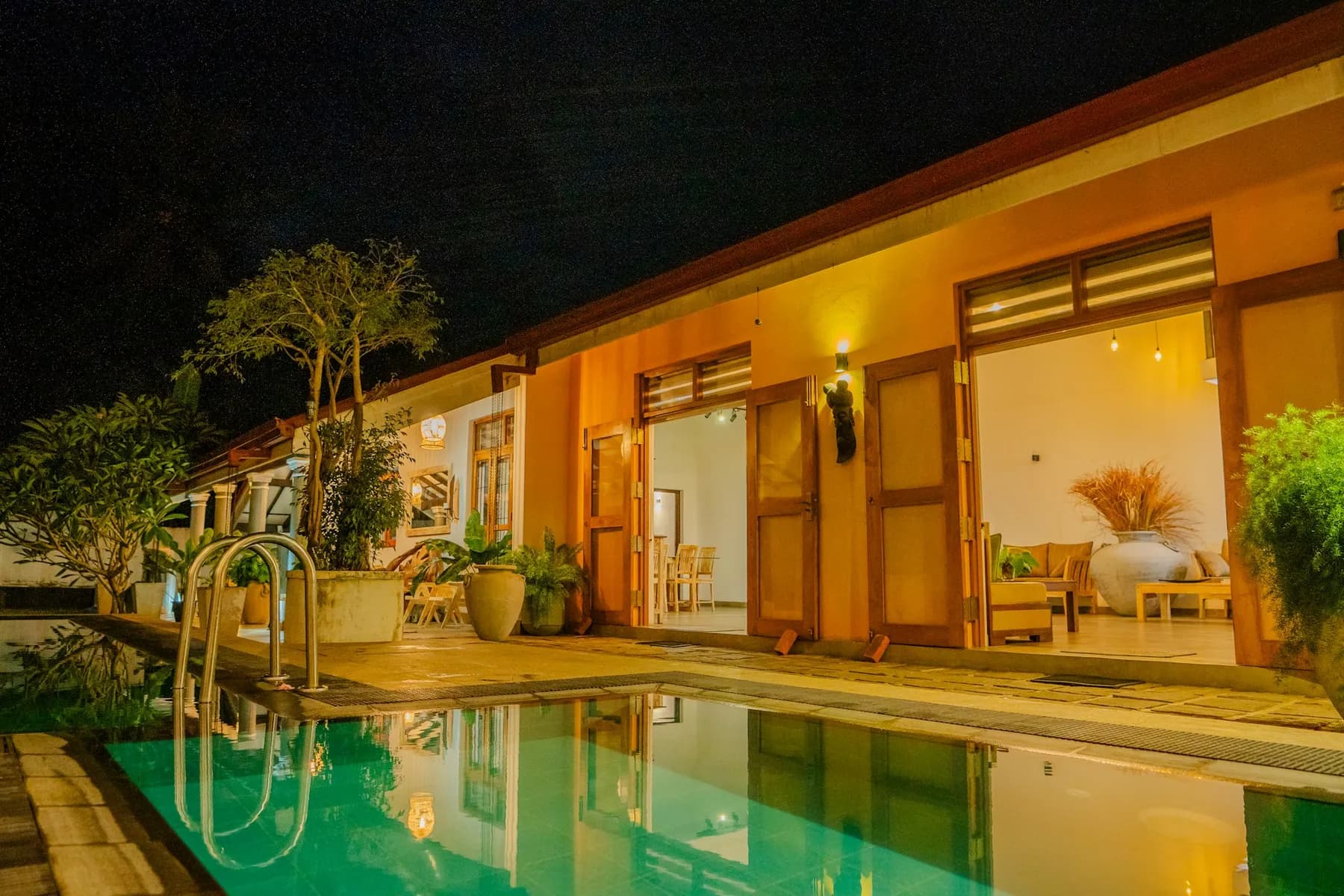 A contemporary Sri Lankan villa illuminated at night